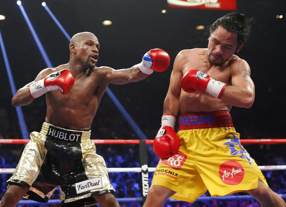 Mayweather, Jr. of the U.S. lands a left to the face of Pacquiao of the Philippines in the 11th round during their welterweight title fight in Las Vegas