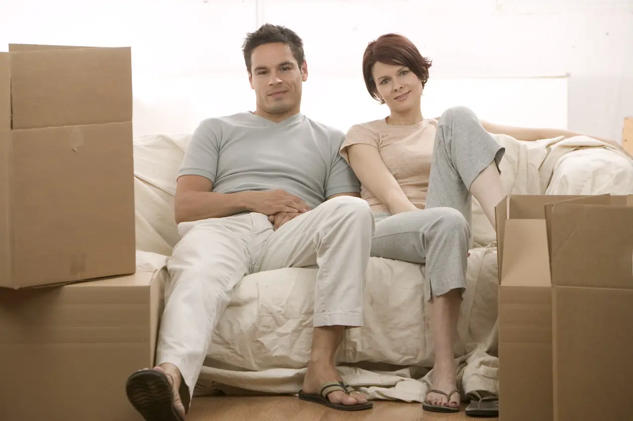 Moving Couple Sitting on Couch