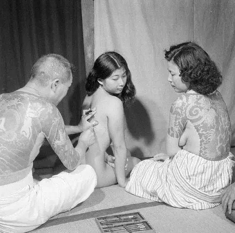 Japanese Woman Being Tattooed