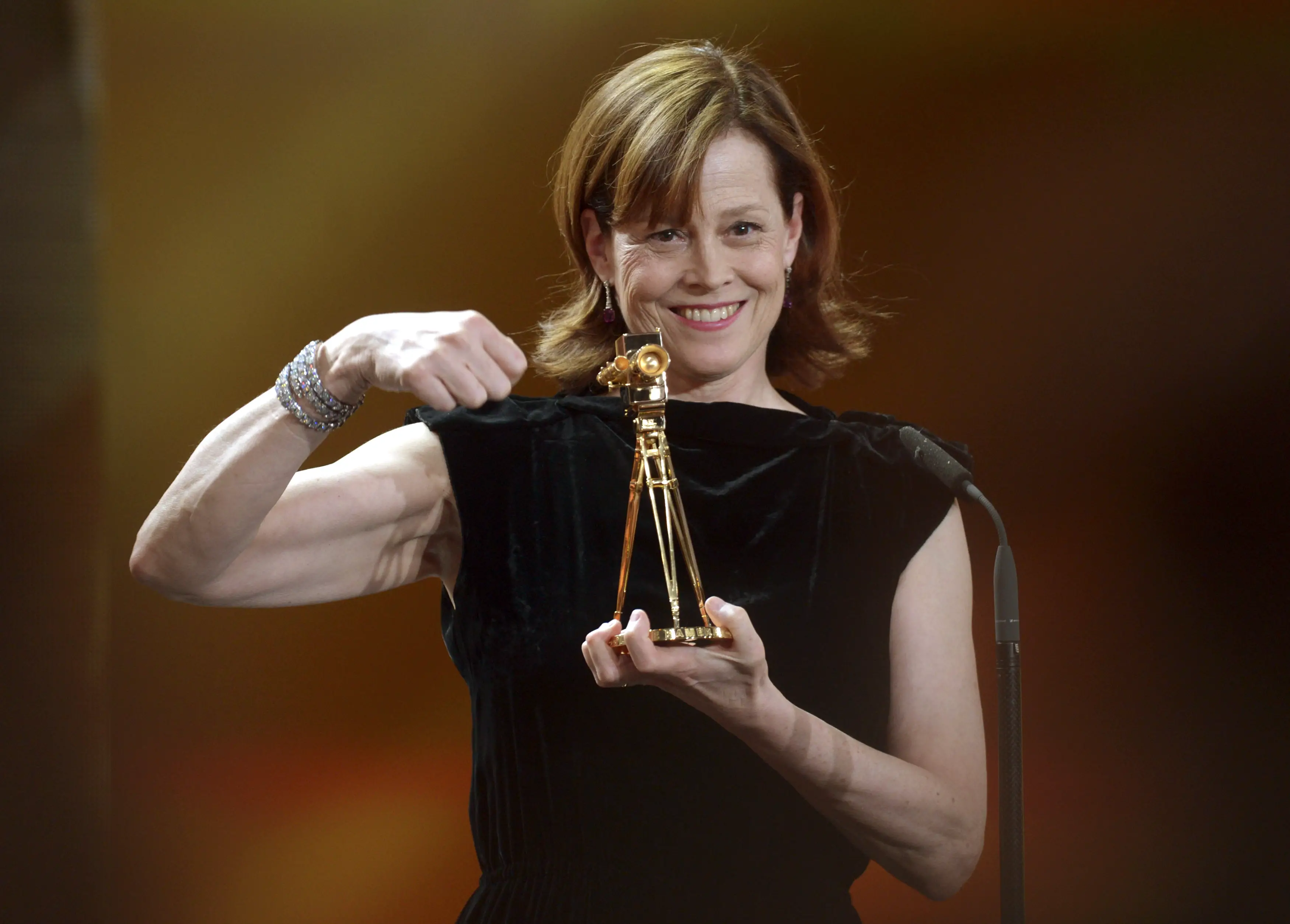 U.S. actress Weaver holds her trophy during 48th Golden Camera award ceremony in Berlin